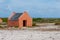 Single historic red slave hut in Bonaire, Caribbean