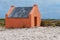 Single historic red slave hut in Bonaire, Caribbean