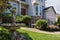 Single Home Frontyard with Manicured Garden and Green Lawn