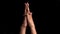 Single human hand coming up and showing Mantangi or Matangi Mudra Yoga Hand Gesture isolated on black background.