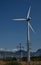 A single isolated huge wind mill in a field in india