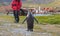 Single king penguin and cruise tourist in Grytviken, South Georgia