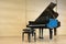 Single kingly placed grand piano with opened wing