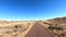 Single lane deserted highway in the Arizona Desert