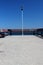 Single Lantern at the end of a landing stage on a clear blue sky