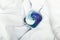 Single laundry detergent pod or pack on a white cloth