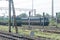 Single Line Passenger trains of Indian Railways standing on long railroad track before level crossings. South Eastern Railway, Old