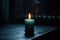 single lit candle in a dimly lit room