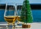 Single malt whisky in the glass with decorative Christmas tree,