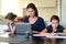 Single mother and daughters at home as the pandemic coronavirus COVID-19 forces many employees and students to work and study