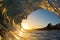 A Single Ocean Wave Tube at Sunset on the Beach