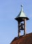 Single old church bell under canopy on roof