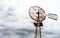 Single old historic wind wheel or wind pump made of wood and metal up close