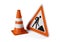 Single orange traffic warning cone or pylon with street or road construction sign on white background - under construction,