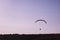 Single parachute on the sky at sunset