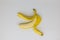 Single peeled yellow banana on white background, studio shot, fruits are healthy