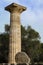 Single pillar of three from Temple of Zeus at ancient Olympia Greece reconstructed with fallen section on side at bottom