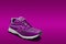 Single pink running shoe