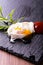 Single poached egg on slate stone with herb and ketchup