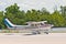 a single prop, private aircraft, landing on a tropical, island airport, in the gulf of Mexico,