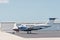 A single prop, private aircraft, parked, on a tropical, island airport, in the gulf of Mexico,