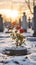 a single red rose is growing out of a tombstone in a snow covered cemetery