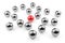 Single red sphere in the middle of group or team of silver spheres over white background, team, leadership or individuality