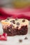 Single red velvet mini cheesecake, macro, vertical composition