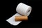 Single roll of unrolled white toilet paper and paper core tube. Isolated on black background