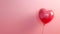 Single Romantic Red Heart balloon on a pink background for Valentines day celebration and gift