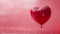 Single Romantic Red Heart balloon on a pink background for Valentines day celebration and gift