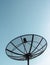 Single satellite dish with blue sky background