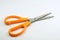 Single scissor with orange handle. Stationary