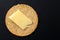 Single Scottish oatcake with a slice of yellow cheese.