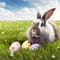 Single sedate furry French Angora rabbit sitting on green grass with easter eggs