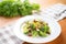 single serving of broccoli raisin salad on a small plate