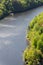 Single ship and lonely pier on river, breathtaking green woods nature landscape, sunny summer day, Vltava, Slapy reservoir