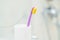 a single simple toothbrush in a glass in bathrooms