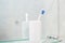 a single simple toothbrush in a glass in bathrooms