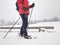Single snow walker or cross skier sports woman and gray clouds i