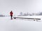 Single snow walker or cross skier sports woman and gray clouds i