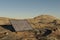 single solar panel standing in desert environment renewable unlimited green energy concept 3D Illustration