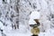 Single stack of snow covered round rocks in a peaceful snowy zen garden