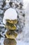 Single stack of snow covered round rocks in a peaceful snowy zen garden