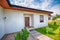 Single storey private house wide angle image, hdr colors, outside view with garden in summer