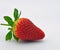 Single strawberry against blue background