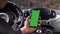 Single Tapping and Holding a Green Screen Smartphone in a Car