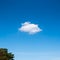 Single tiny cloud on blue sky.