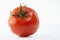 Single tomato with water droplets, close-up