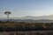 Single tree and a mountain chain behind